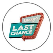 A neon sign that reads "Lucky's Last Chance."
