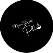 Logo for Main Street Pho featuring a bowl of pho and elegant cursive text.