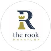 Logo for "The Rook Manayunk" featuring a stylized letter "R" with a chess rook icon.